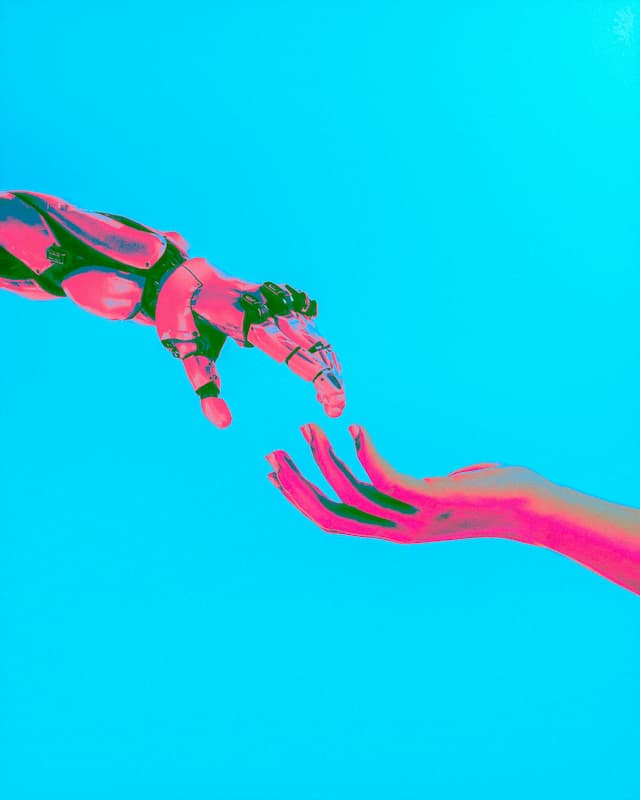 Human and robot hands reaching towards each other